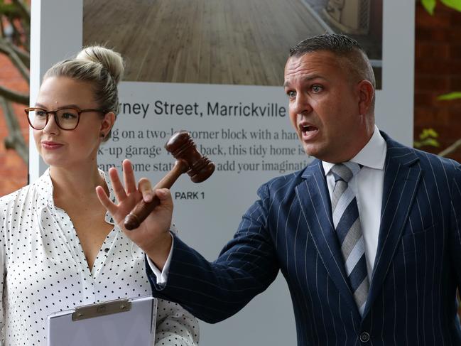 Saturday Auction at 2 Harney St, Marrickville. A large crowd was quickly outbid with the home selling for 1.73 Million Dollars. Pictured is the Auctioneer Clarence White. Picture: David Swift.