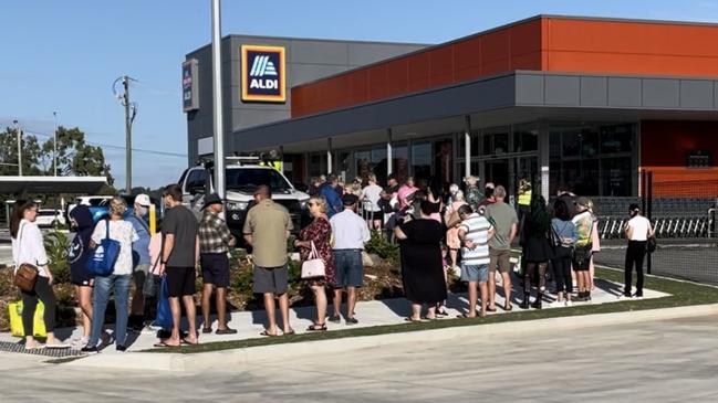 Lines started at 7am and stretched across the carpark as shoppers jostled for the honour of being the first inside Mackay's new Aldi. Photo: Fergus Gregg