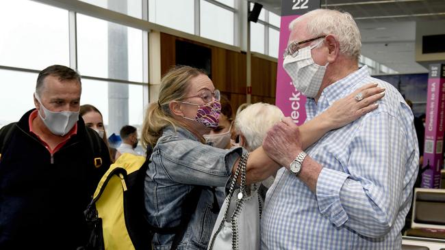 Anna Cock is reunited with her parents Jenny and Leon at Adelaide Airport on November 23. Picture: Naomi Jellicoe