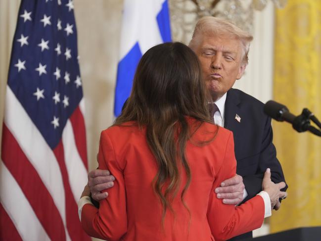 Kimberly Guilfoyle hugs President Donald Trump after speaking at a reception celebrating Greek Independence Day in the East Room of the White House. PIcture: AP Photo.