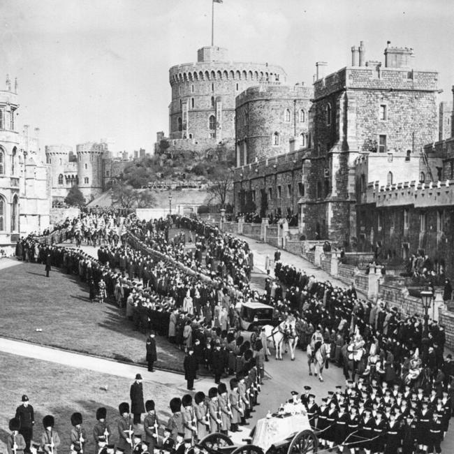 Sailors pull the gun carriage bearing George VI’s coffin as his funeral procession arrives at Windsor Castle in February 1952. Picture: Keystone/Getty Images/The Times