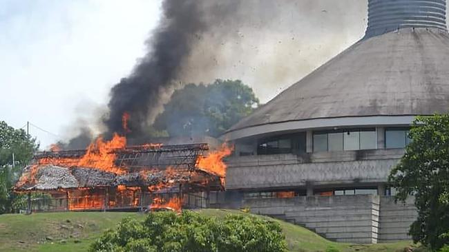 On November 24, 2021 a building burning next to the parliament building in Honiara on the Solomon Islands during riots. Picture: Supplied