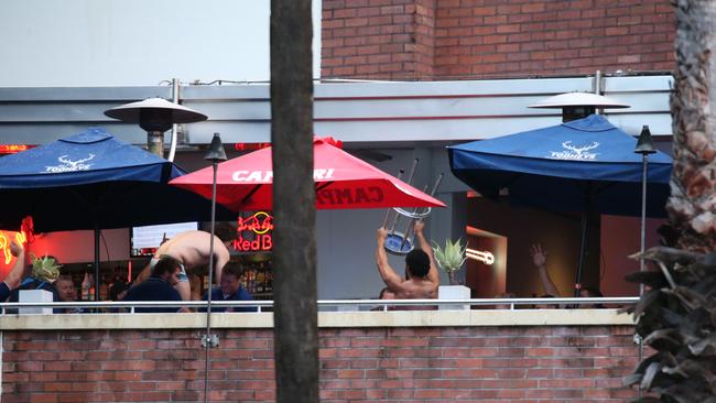 Bulldogs players are pictured on the balcony of the Harbour View Hotel. Picture: Justin Lloyd.