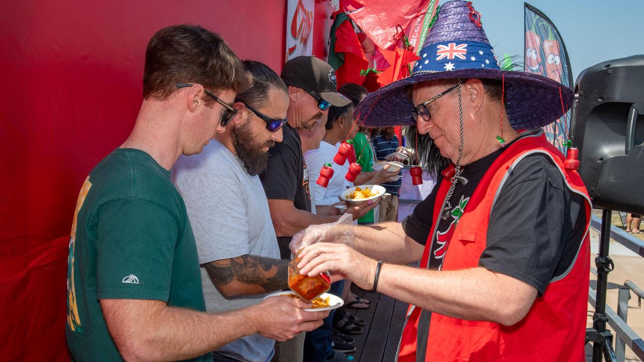 Wayne Marsh serves out the hot sauce at the Murphys Creek Chilli and Craft carnival. Sunday, September 22, 2024. Picture: Nev Madsen