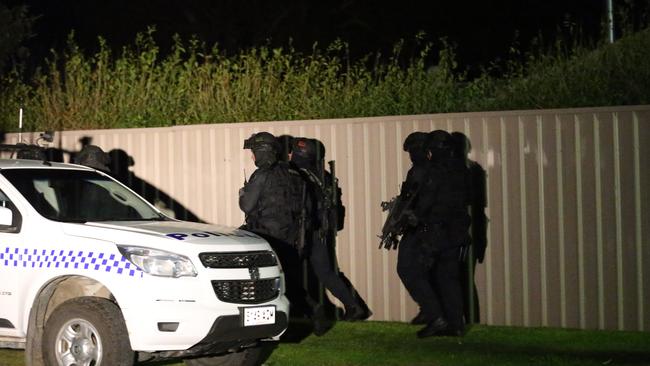 STAR Force officers leaving the scene after the incident in Goolwa. Picture: Stephen Laffer