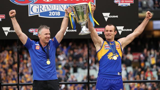 Adam Simpson and Shannon Hurn lift the premiership cup. Picture: Phil Hillyard