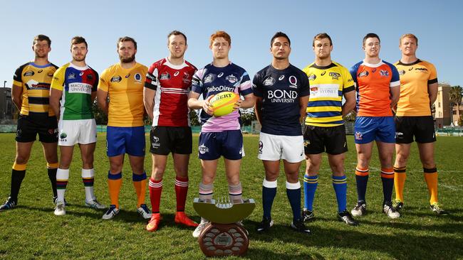 Captains from the nine NRC clubs pose with the trophy and game ball at the official launch of the National Rugby Championship at Coogee Oval in Sydney.