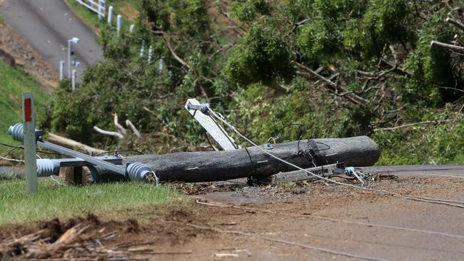 Fallen power lines and power poles caused major traffic hazards across multiple roads at Eagle Heights, Mt Tamborine after a massive storm swept through on Christmas night. Picture: Scott Powick