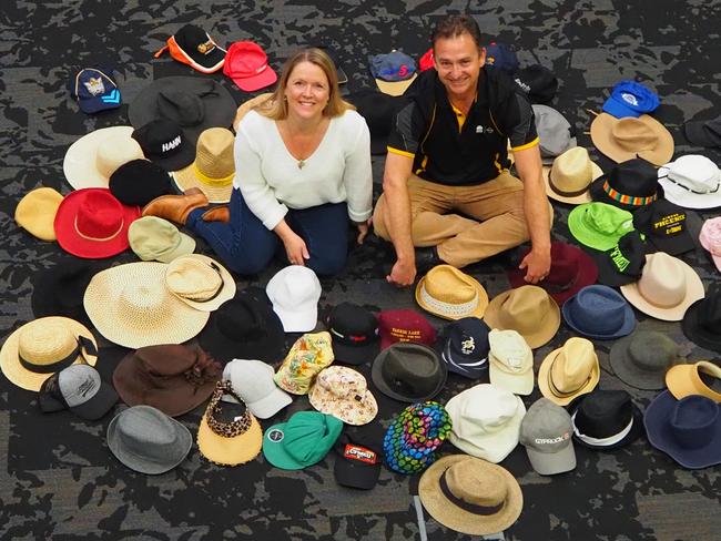 NSW Road Trauma Support Group member, Tania Brown, and Transport for NSW Senior Manager Community and Place Partner, Brad Crispin, with some of the hats collected as part of a road safety campaign.