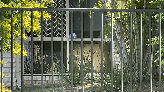 A shattered front window at the Upper Coomera home where it's understood the confrontation took place. Picture: Supplied.