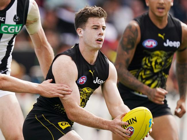 Jack Higgins of the Tigers runs with the ball during the AFL Marsh Community Series pre-season match between the Richmond Tigers and the Collingwood Magpies at Norm Minns Oval in Wangaratta, Sunday, March 1, 2020. (AAP Image/Michael Dodge) NO ARCHIVING, EDITORIAL USE ONLY