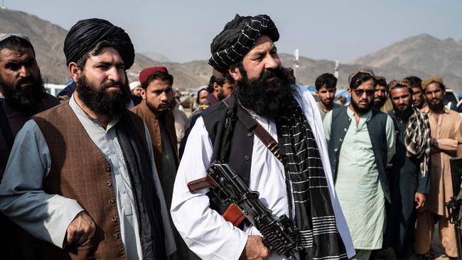 Khalil Haqqani, Taliban minister for refugees and repatriation, seen in the centre of the above picture taken in 2023, was killed inside the ministry by a suicide bomber who evaded security, according to a source. Picture: Wakil Kohsar / AFP