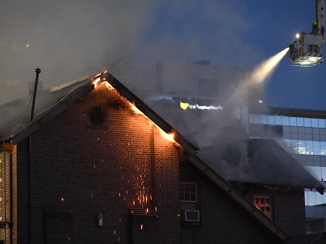 Multiple fire crews were needed to fight the early morning fire. The building was completely destroyed by fire. Picture: Gordon McComiskie