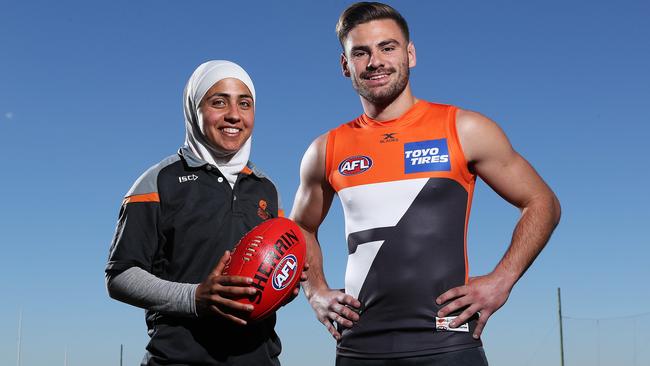 Lael Kassem, pictured with GWS jet Steve Coniglio has hopes of winning a spot with the Giants’ AFLW team. Picture: Brett Costello