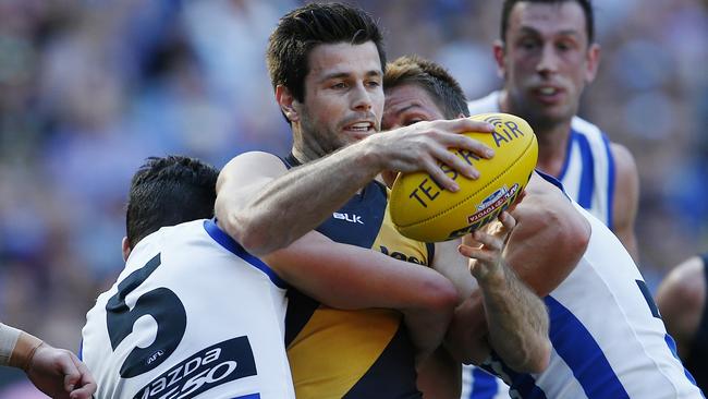 Trent Cotchin is gang tackled by Ben Jacobs and Andrew Swallow in the 2015 elimination final. Picture: Michael Klein