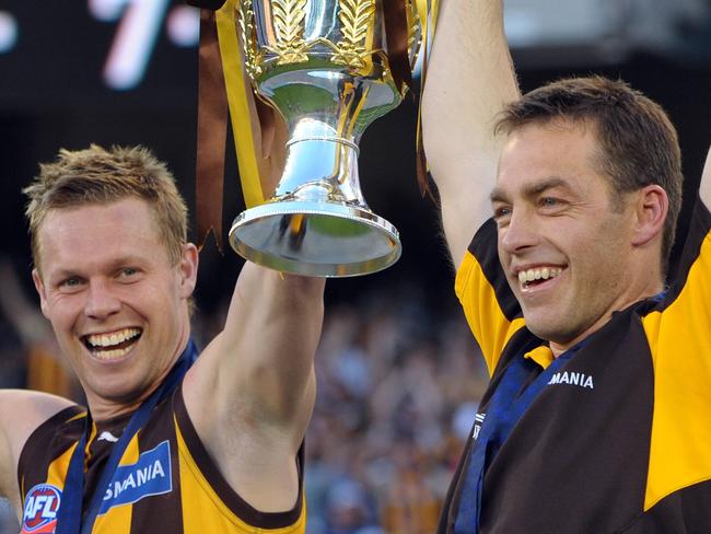 27/09/2008 SPORT: 2008 Grand Final. Geelong v Hawthorn. MCG. Hawthorn captain Sam Mitchell and coach Alastair Clarkson hold aloft the premiership cup.