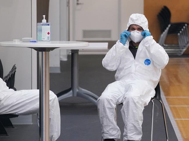 Cleaners are seen working at Essendon’s headquarters. Picture: AAP