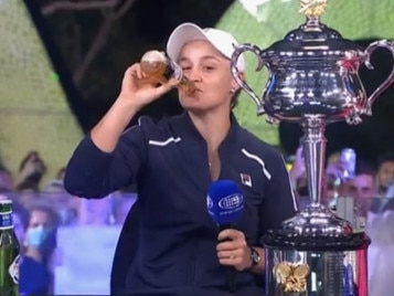 Ash Barty celebrates her 2022 Australian Open win with a beer during an interview on Channel 9 on Saturday, January 29, 2022.Picture: Supplied