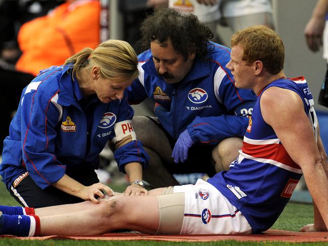 North Melbourne v Western Bulldogs. MCG. Adam Cooney gets his right knee attended to late in the 4th q