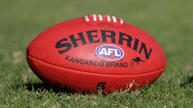 Generic AFL Sherrin football and football boots. sport /