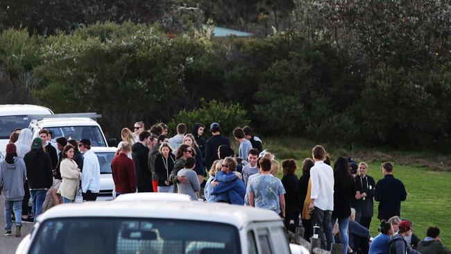 Friends gather at Warriewood Headland after hearing the devastating news.