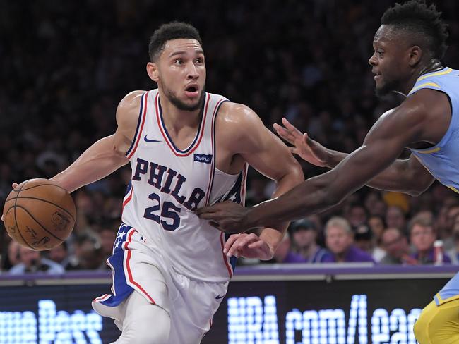 Ben Simmons drives against Lakers forward Julius Randle.