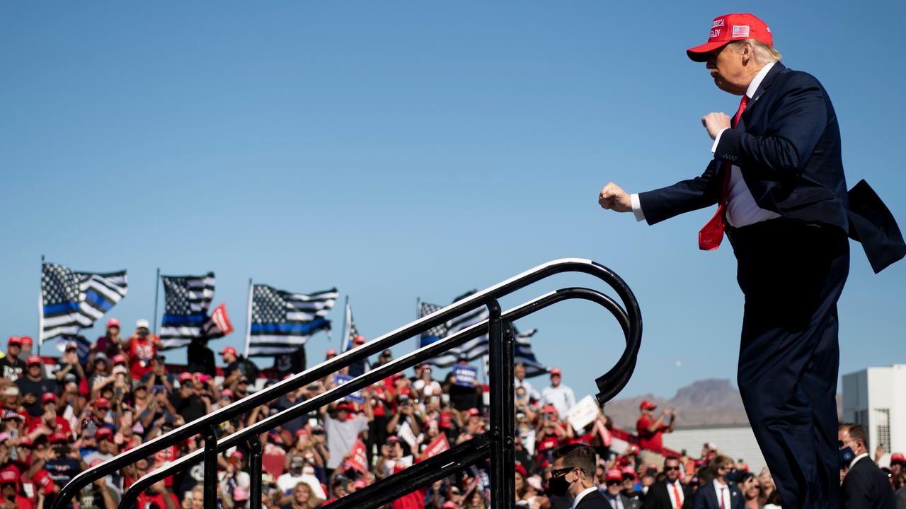 Mr Trump dancing as he leaves a Make America Great Again rally in Arizona. Picture: Brendan Smialowski/AFP