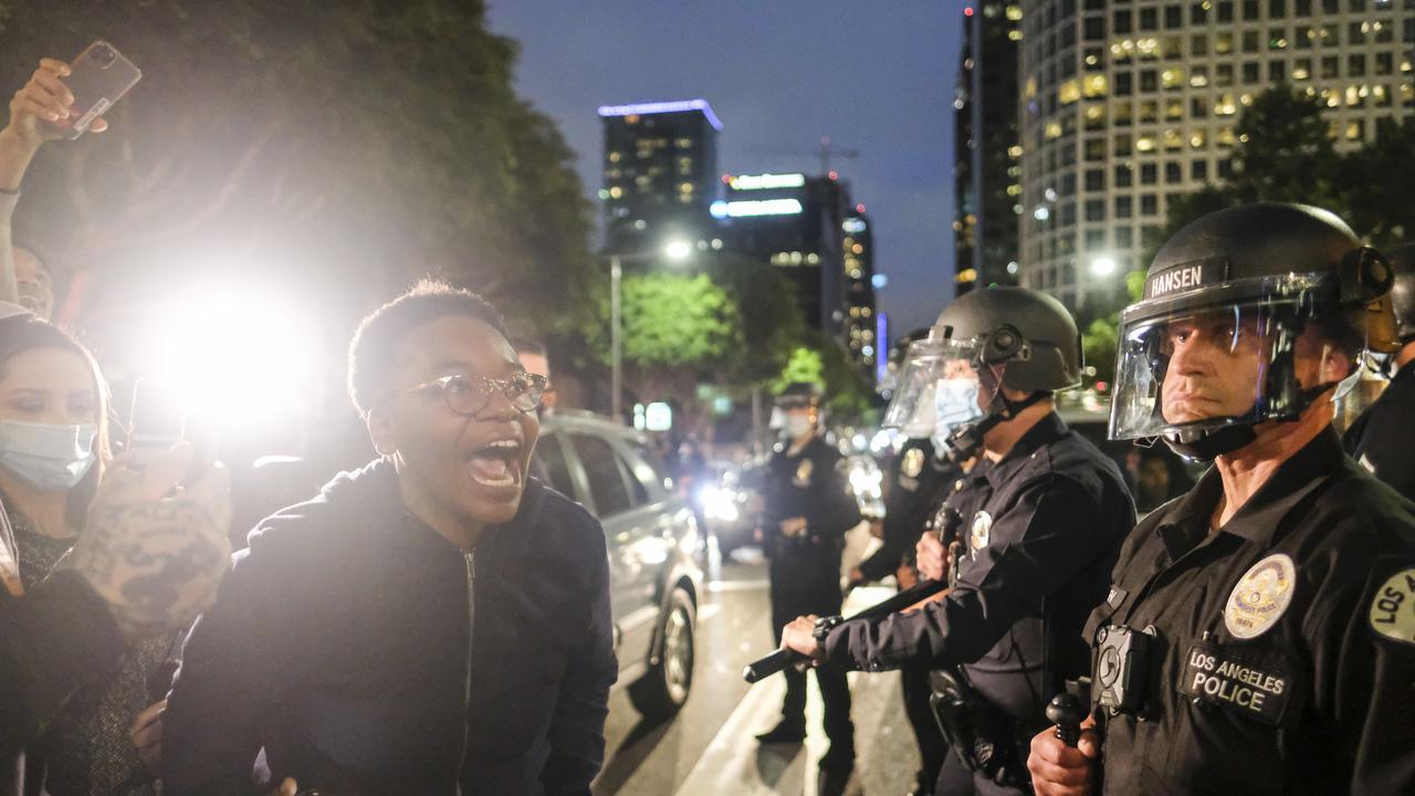 A protester screams at police. Picture: Ringo H.W. Chiu/AP