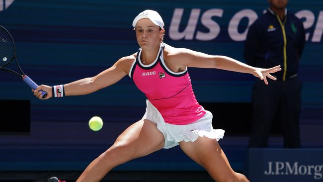 Ash Barty returns against Zarina Diyas during their round 1 match at the US Open