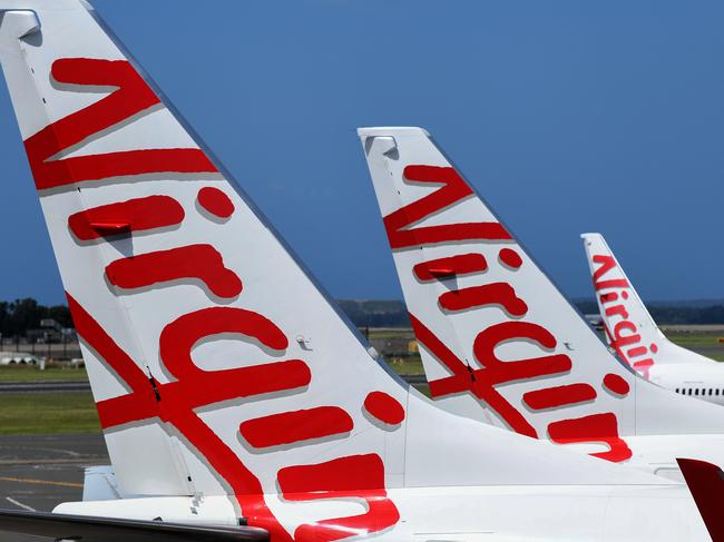 SYDNEY, AUSTRALIA - NCA NewsWire Photos FEBRUARY, 4, 2021: Virgin Australia aircraft are seen on the tarmac at Sydney Domestic Airport, Sydney. Virgin Australia says the end of JobKeeper in March could signal a mass shedding of workers if no further support is provided to the struggling aviation industry which has been out of action for almost one year. Picture: NCA NewsWire/Bianca De Marchi