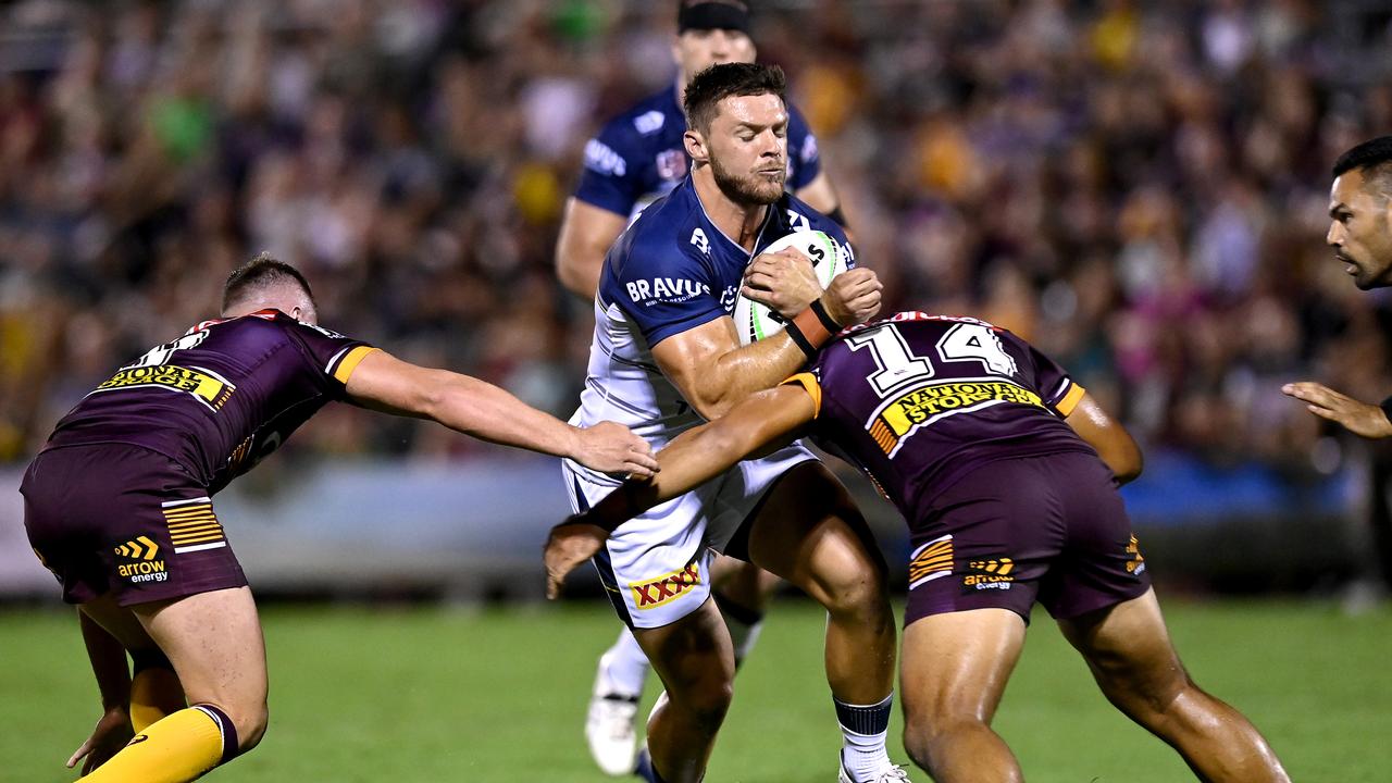 BRISBANE, AUSTRALIA - FEBRUARY 27: Corey Jensen of the Cowboys takes on the defence during the NRL Trial Match between the Brisbane Broncos and the North Queensland Cowboys at Moreton Daily Stadium on February 27, 2021 in Brisbane, Australia. (Photo by Bradley Kanaris/Getty Images)
