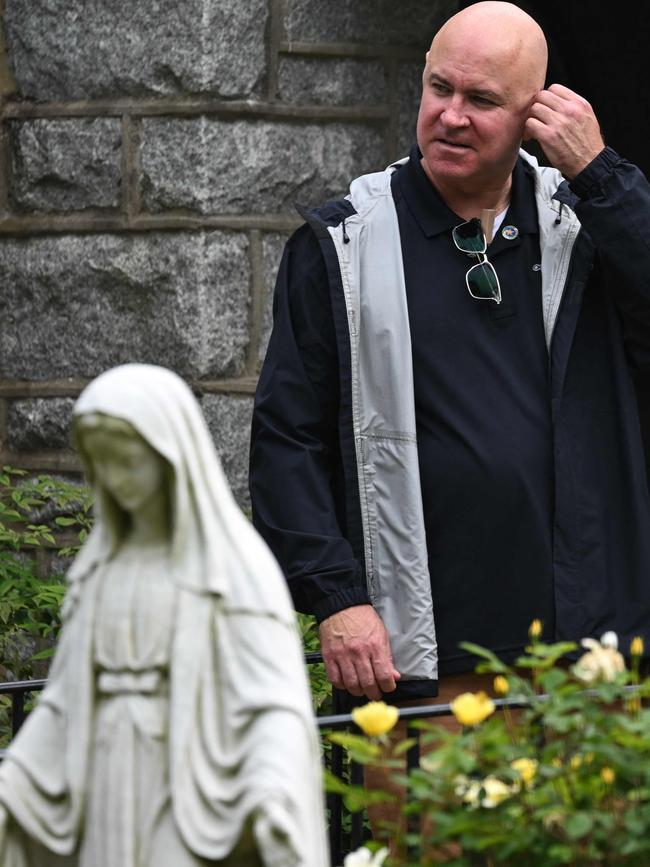 A Secret Service agent adjusts his headset as Joe Biden attends Mass in Delaware n May. Picture: AFP