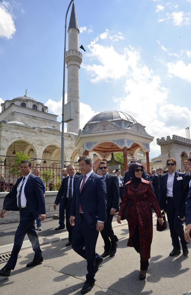 Turkish Prime Minister Ahmet Davutoglu walks in front of the restored Ferhat Pasha mosque after its official opening ceremony, in Banja Luka, Bosnia. The mosquewas blown up by Christian Orthodox Serbs during the 1992-1995 war. Picture: AP