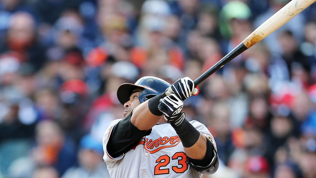 Baltimore Orioles' Nelson Cruz holds his daughter, Giada, during a news  conference following Game 3 of baseball's AL Division Series Sunday, Oct.  5, 2014, in Detroit. Baltimore defeated the Detroit Tigers, 2-1