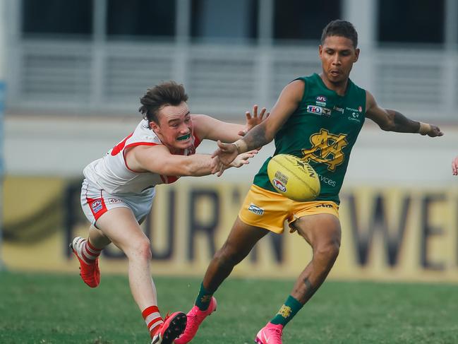 Nicholas Yarran under pressure from Jack Cattanach  in Round 11 Women's NTFL: PINT v Waratah at DXC Arena.Picture GLENN CAMPBELL