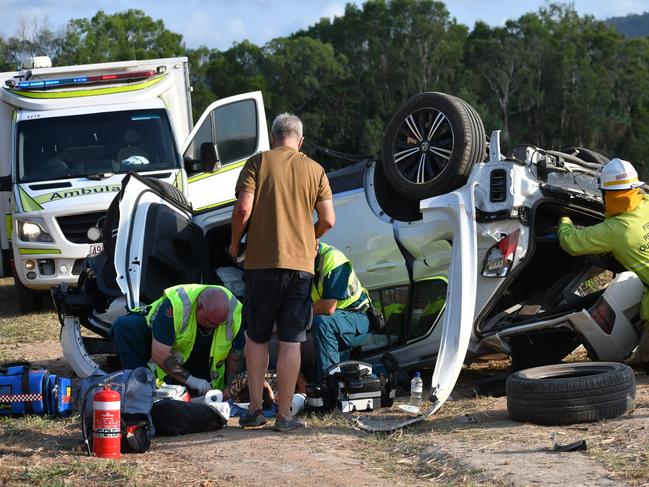Emergency services respond to a single-vehicle accident on the Bruce Highway between Ingham and Townsville. Picture: Cameron Bates