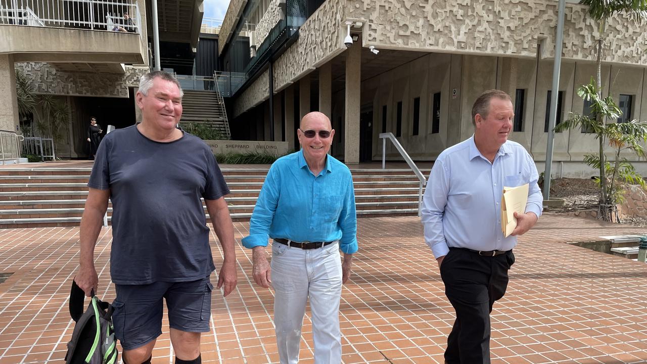 Mark Fishburn, Tony Green, and Alan Sheret leave the Townsville Courthouse after appearing in the Planning and Environment Court in September.