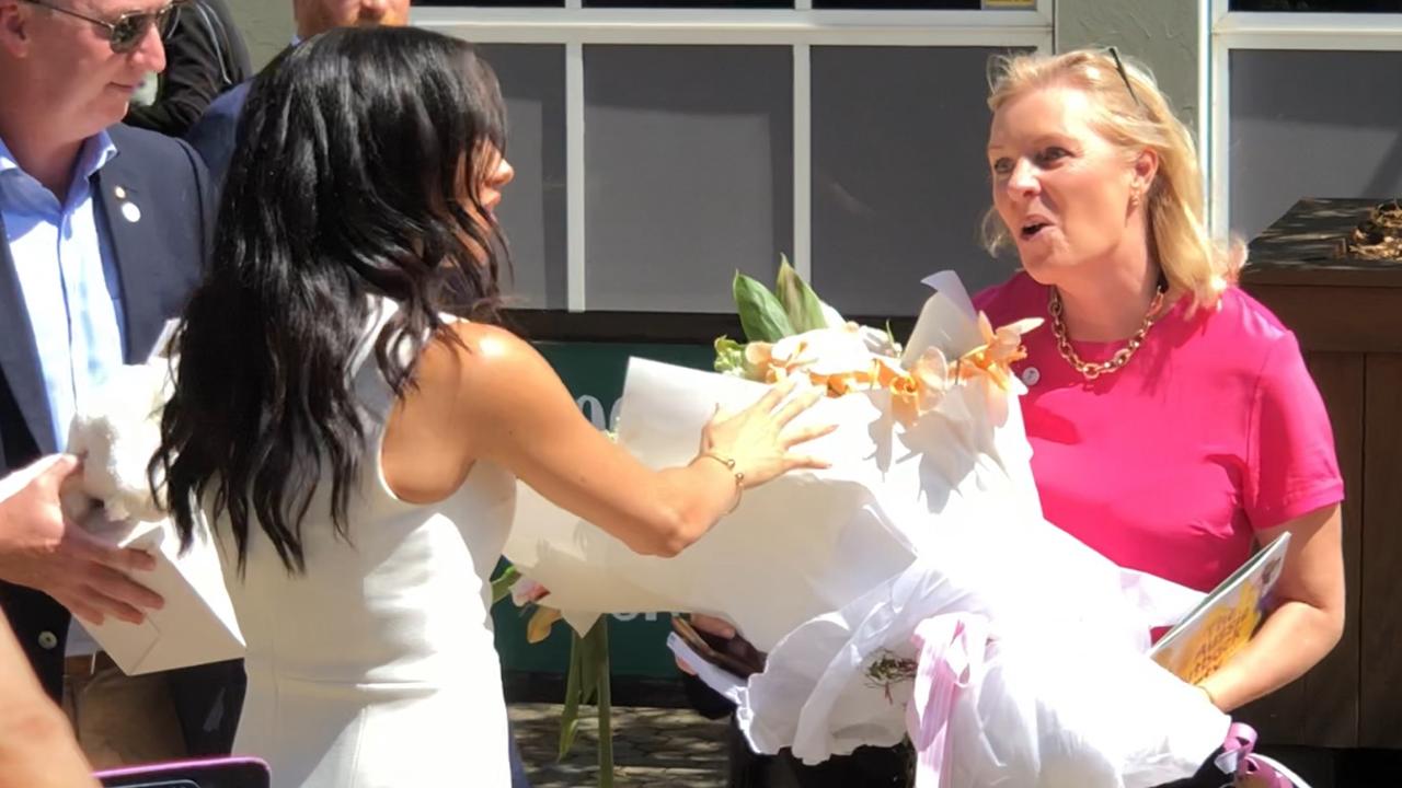 Meghan seemed ’genuinely excited and flattered’ to receive the flowers.