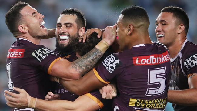 Darius Boyd and Jack Bird celebrate James Roberts’ try. (Phil Hillyard)