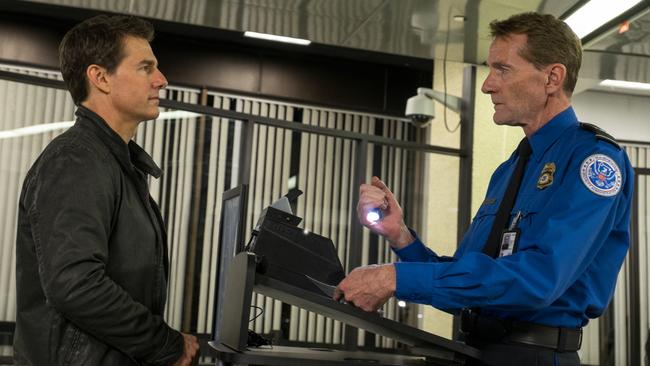 CRUISE CONTROL Tom Cruise as Jack Reacher and Lee Child playing TSA Agent in a scene from film Jack Reacher: Never Go Back from Paramount Pictures and Skydance Productions