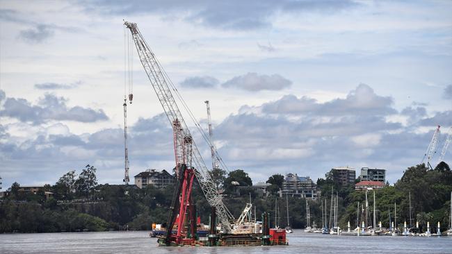 A pontoon and crane dislodged and caused mass evacuations from all sides of the river. Picture: Amanda Parkinson