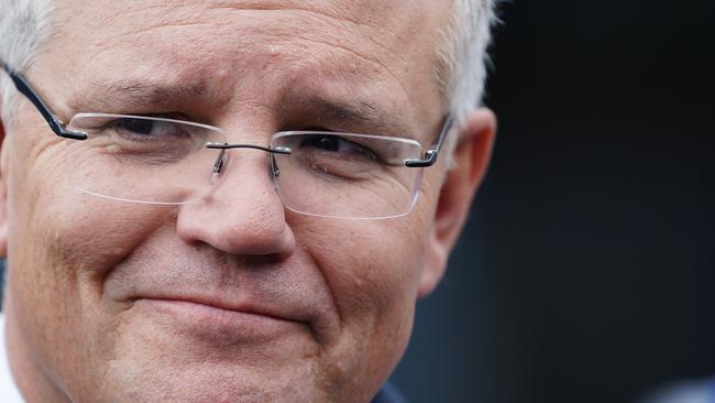 Prime Minister Scott Morrison speak to the media during a press conference at Sunshine Train Station in Melbourne, Wednesday, March 13, 2018. A long-awaited rail link to Melbourne airport edging closer to reality, with the prime minister and Victorian premier pledging a combined $10 billion in funding. (AAP Image/Stefan Postles) NO ARCHIVING