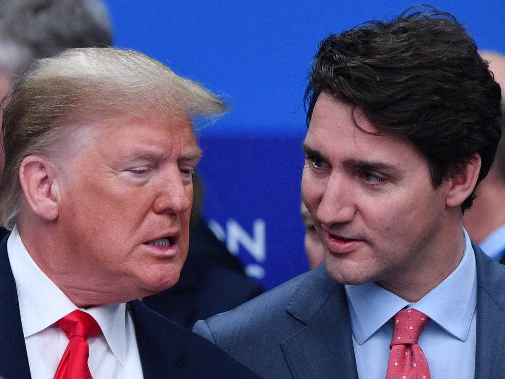 US President Donald Trump talks with Canada's Prime Minister Justin Trudeau. Picture: AFP