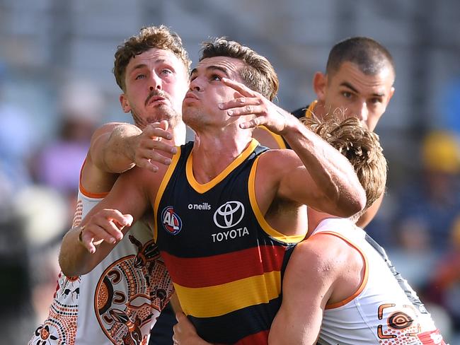 Ben Keays under siege from the Giants.