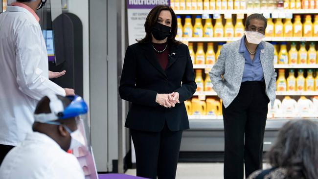 US Vice President Kamala Harris watches medics administering the vaccine. Picture: AFP.