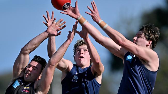 VAFA: Who wants it? Old Melburnians’ and Old Xaverians’ players reach for the mark. Picture: Andy Brownbill