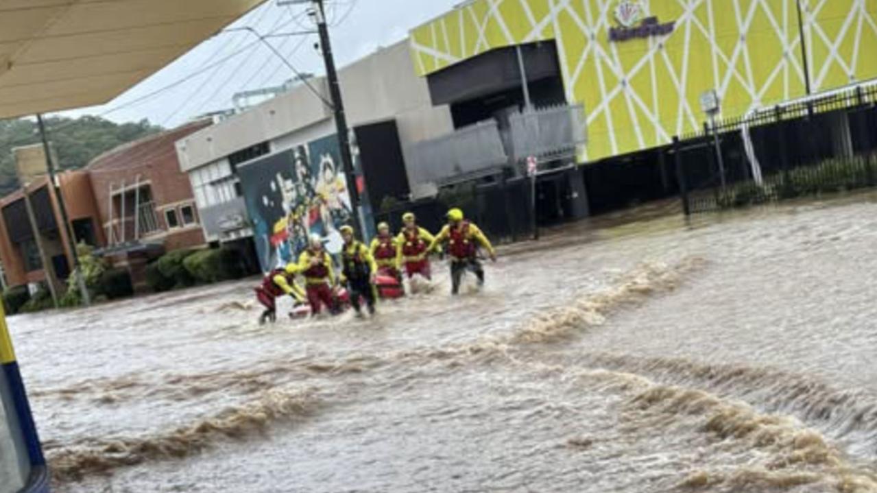 WATCH: Drivers rescued from roofs, 100 roads closed as towns hit by 350mm of rain