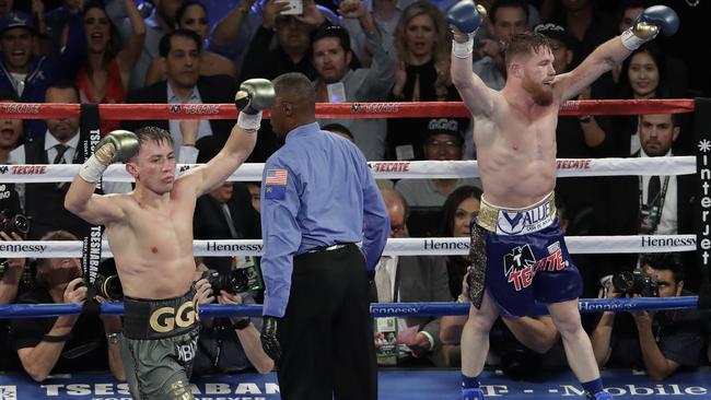 Canelo Alvarez and Gennady Golovkin celebrate following their title fight.