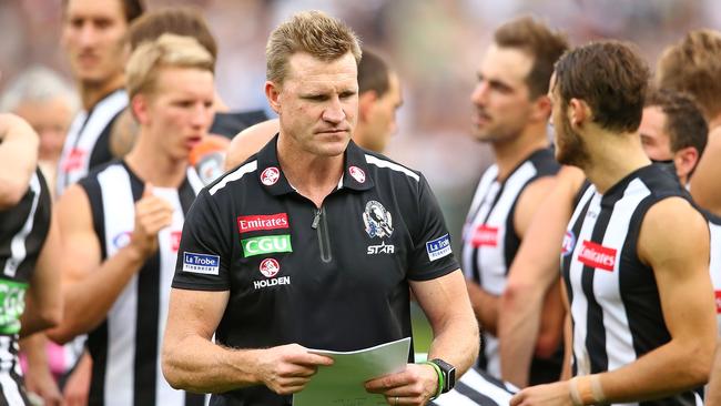 Nathan Buckley walks away from his players after a quarter break.
