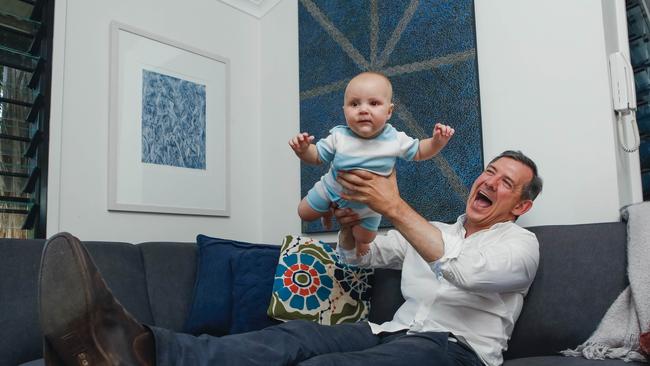 Chief Minister Michael Gunner celebrates with son Hudson, a win in the 2020 election , allowing Labor to govern in its own right. Picture GLENN CAMPBELL